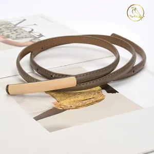 Minimalist vintage women's slim leather belt with a polished gold rectangular buckle