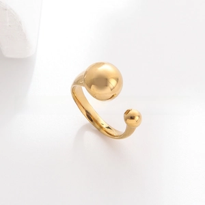 Close-up of golden stainless steel open ring with dual polished bead design features