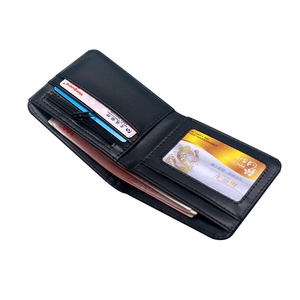 Slim bifold skull wallet with multiple card slots and zipper coin pocket on white background