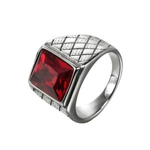 Vintage steel ring with square red gemstone and intricate textured band detailing