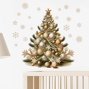 Detail of Christmas tree wall sticker with gold ornaments above a white nursery crib