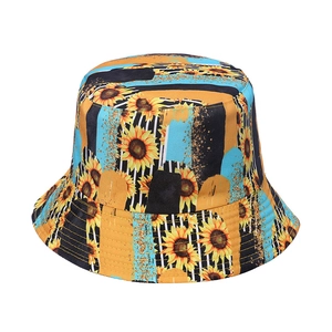 Sunflower pattern bucket hat featuring bright yellow floral and black stripe design