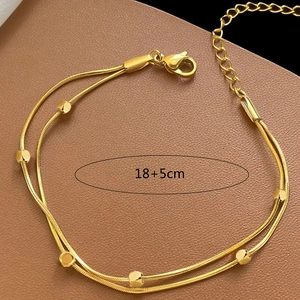 Double-layered gold stainless steel snake chain bracelet with polished cubes and lobster clasp