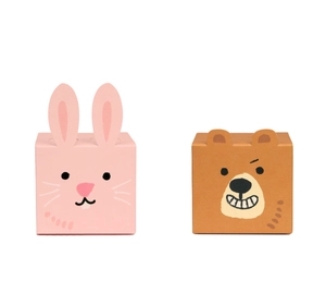 Close-up of cute rabbit and bear themed foldable paper gift boxes for candy packaging