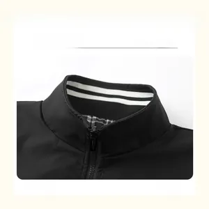 Detail showing the stand-up collar with metallic zipper and white knit stripes lining