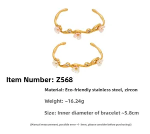 Detailed close-up of 18k gold plated stainless steel floral bangles with zircon stones