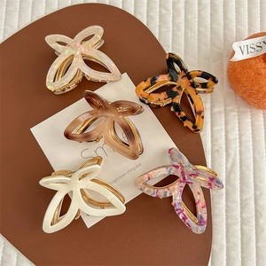 Set of 5 butterfly hair claw clips in pearl white, tortoiseshell, and marble resin patterns