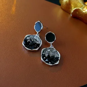 Irregular silver needle earrings with black crystals and vintage geometric drop design
