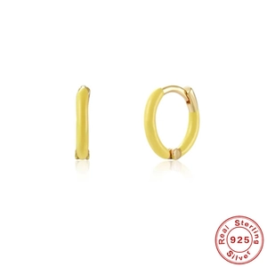 Detailed macro view of yellow enamel S925 sterling silver hoop earrings with gold plating