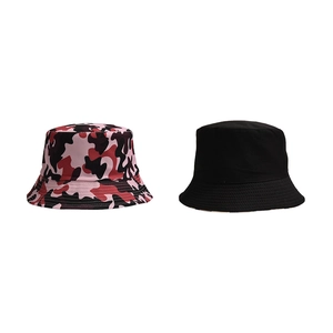 Side-by-side view of a pink camouflage bucket hat and a classic solid black outdoor sun hat