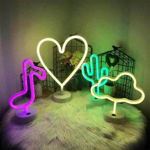 Detail showing musical note, heart, cactus and cloud LED neon lights on a plush rug