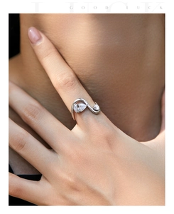 Macro view of S925 sterling silver ring with pear-cut zircon on a model's finger