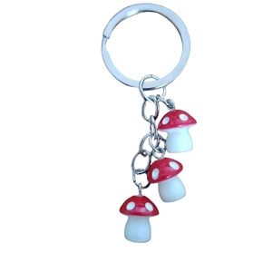 Resin mushroom keychain with red spotted caps and silver metal ring accessory