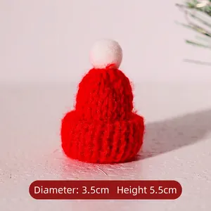 Mini red knitted Christmas hat with white pompom detail, 3.5cm wide and 5.5cm high