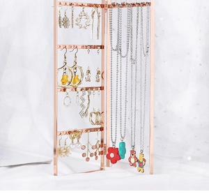 Detail view of foldable rose gold iron earring rack with multi-layered storage holes