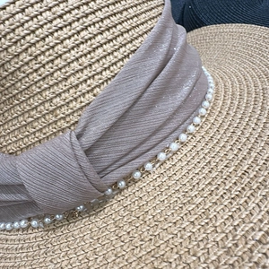 Elegant summer straw sun hat with champagne satin ribbon and delicate pearl trim details
