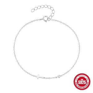 925 sterling silver mini cross bracelet with a round sparkling cubic zirconia charm