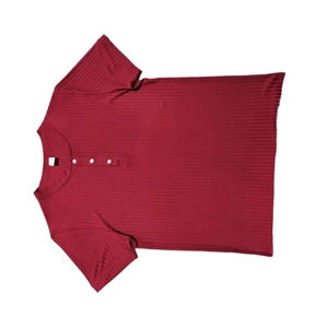 Close-up of red ribbed knit Henley shirt detailing V-neckline with three buttons
