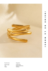 Detailed close-up of 18K gold plated multi-layer spiral ring with a high polished finish