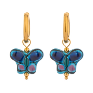 Detail shot of golden butterfly drop earrings with vibrant blue resin wings on white background