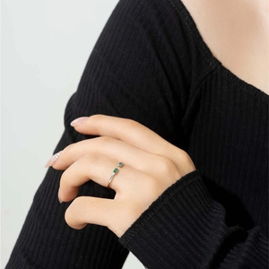 Adjustable S925 silver ring featuring dual rectangular green emerald-cut stones
