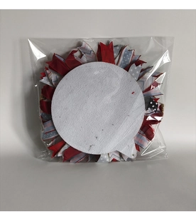 Detail of USA Independence Day wreath packed in clear bag with red blue ribbons