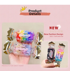 Close-up of colorful high-elastic hair ties in creative candy-shaped storage boxes