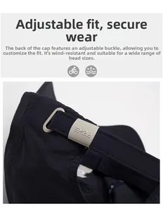 Detail of adjustable metal buckle with logo on a black quick-dry baseball cap