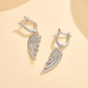 Macro detail of S925 sterling silver feather earrings with pavé-set cubic zirconia stones