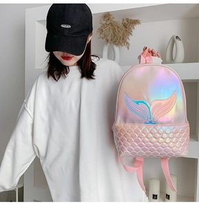 Detail of laser pink mermaid backpack featuring tail embroidery and fish scale texture