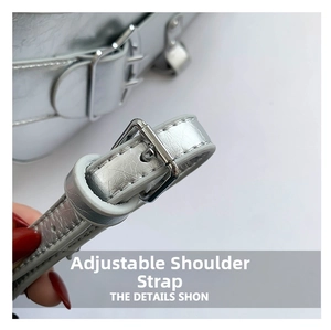 Macro shot of adjustable silver metallic leather strap with buckle on a biker bag