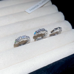 Macro detail of silver ear cuff set featuring zircon pavé and geometric minimal designs