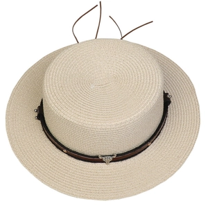 Detailed top-down view of woven straw hat featuring a brown leather band and bull head ornament