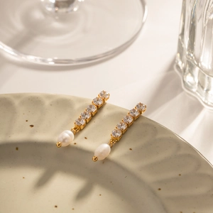 Elegant gold drop earrings with five cubic zirconia stones and fresh water pearls