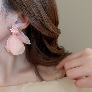 Sweet pink floral fabric lace earrings with beaded petals and leaf accent on model