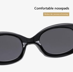 Detail of comfortable integrated nose pads on black oval sunglasses to reduce pressure
