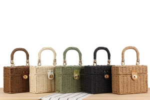 Detail of five woven box bags with metal ring handles and leather buckle closures