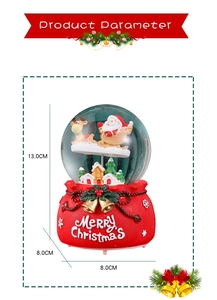 Detailed view of Christmas snow globe with Santa sleigh and dimensions 13cm by 8cm