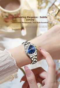 Close-up of luxury men's quartz watch with blue dial and gold-silver steel strap