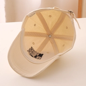 Detail view of cotton baseball cap interior featuring reinforced seams and wash label