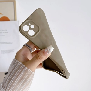 Close-up of olive green crinkled silicone case for iPhone showing camera protection