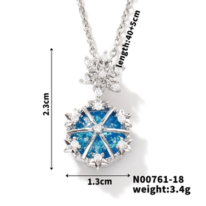Detailed view of silver snowflake pendant with blue gemstone and size dimensions