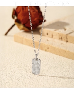 Detailed view of S925 sterling silver rectangular pendant necklace with moissanite pavé