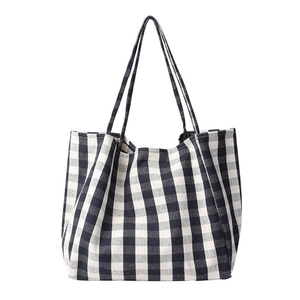 Classic black and white checkerboard canvas tote bag with long shoulder straps