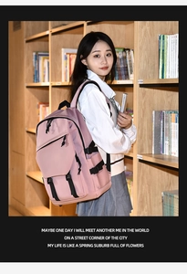 Detailed side view of a pink casual backpack with black buckle straps in a bookstore