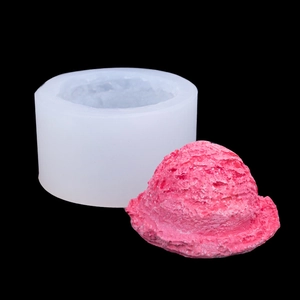 White silicone ice cream scoop mold with pink dessert model on a professional black background