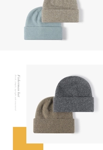 Detail showing various colors of knitted fisherman hats with soft wool blend texture