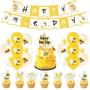 Bee themed party supplies set featuring HAPPY BEE DAY banner and matching cake decorations