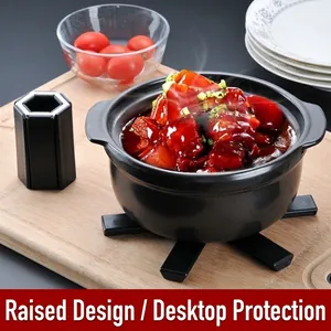 Heat-resistant black folding pot mat with elevated support for dining table protection