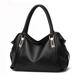 Minimalist black leather tote bag for women with gold hardware and lychee grain texture